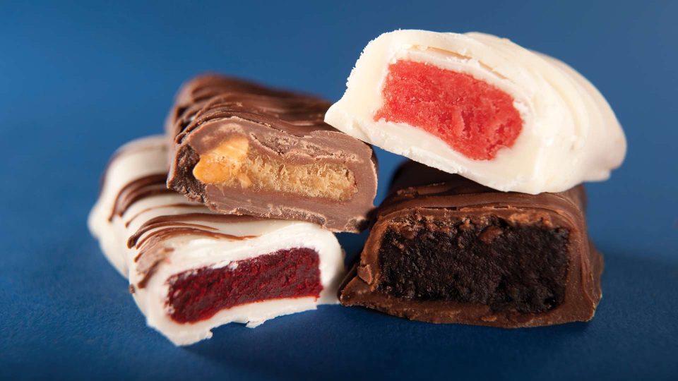 four candy bars made of cake