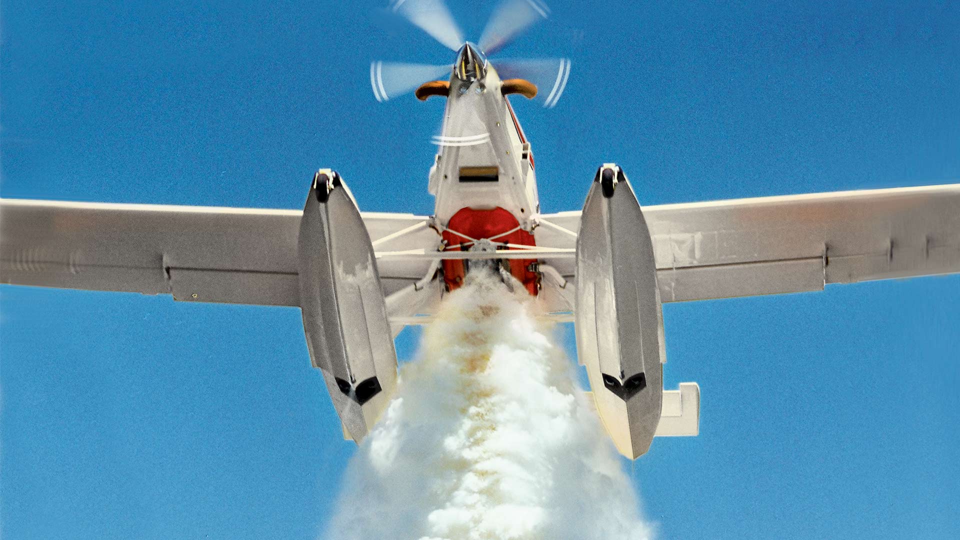 plane dropping fire retardant