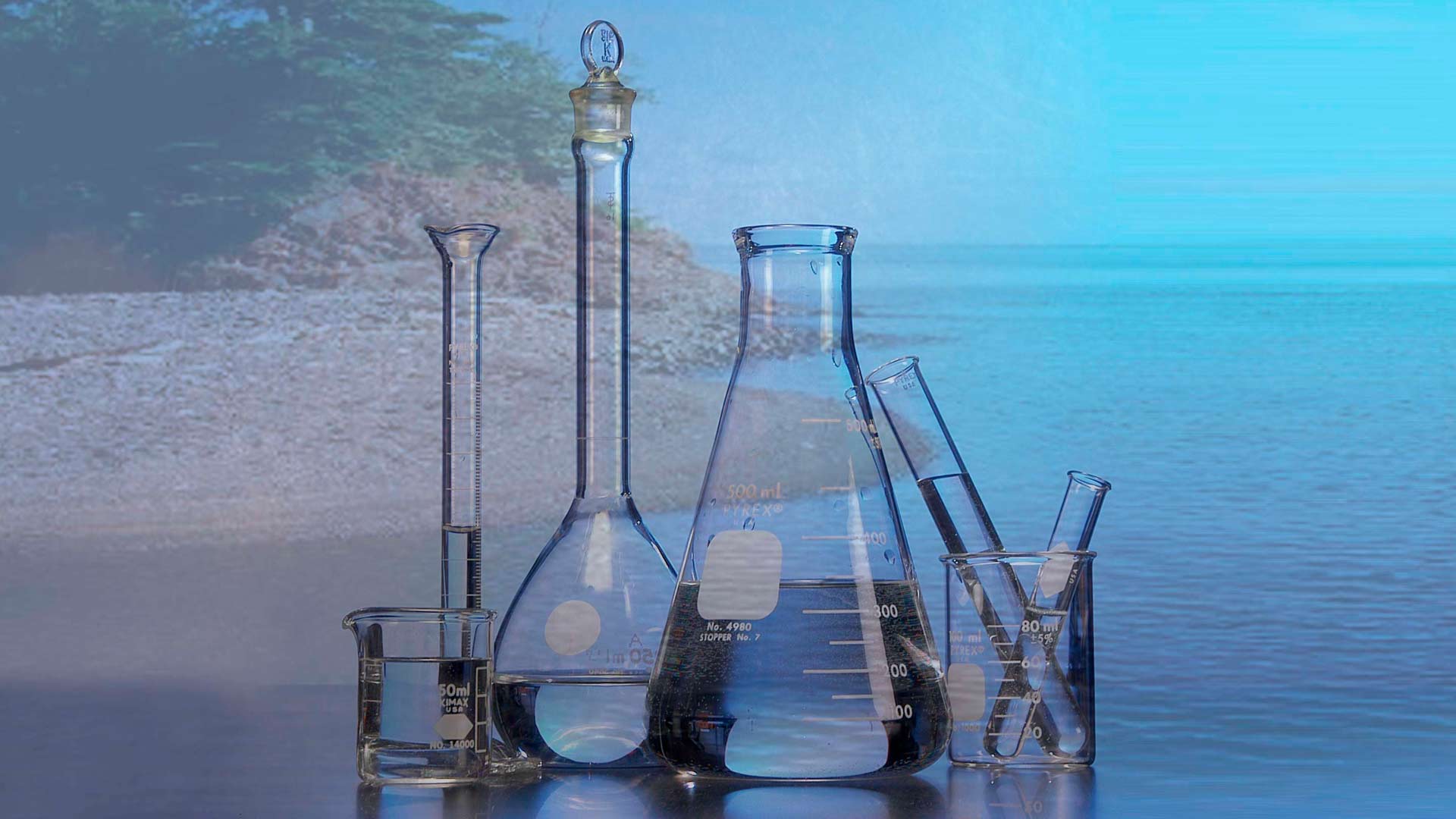 lake in background of science glass measuring containers